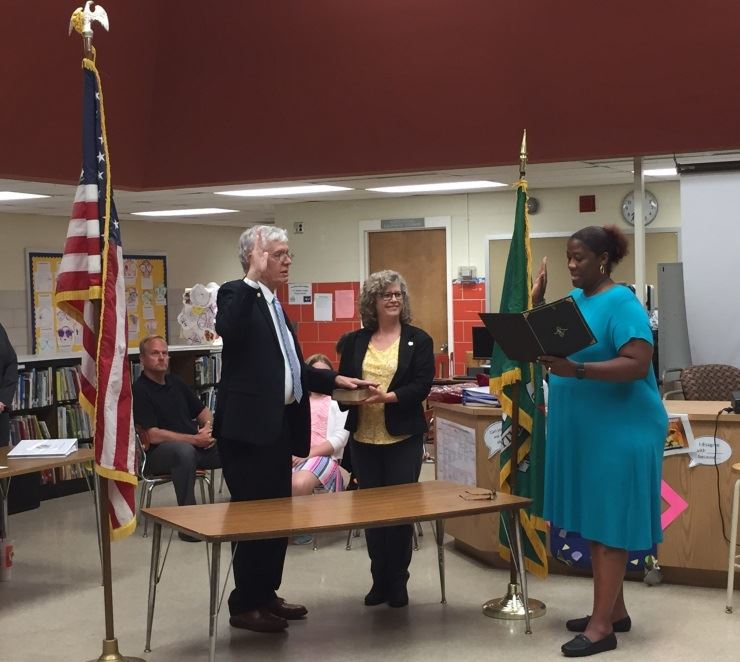 Mayor Carey swearing with clerk