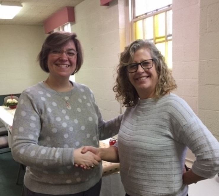 Tracey and Andrea shaking hands