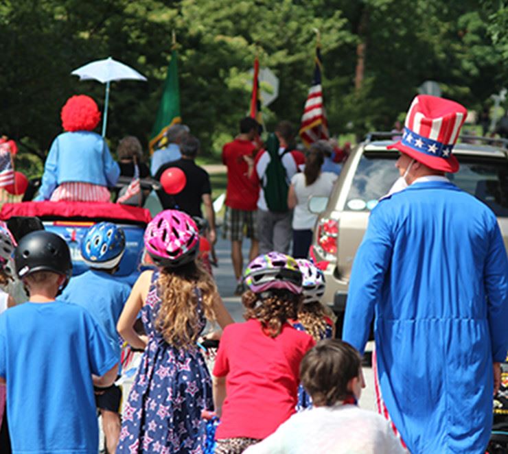 citizens participating in a Fourth of July parade
