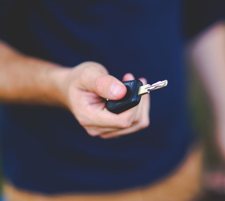 Man holding car keys in his hand