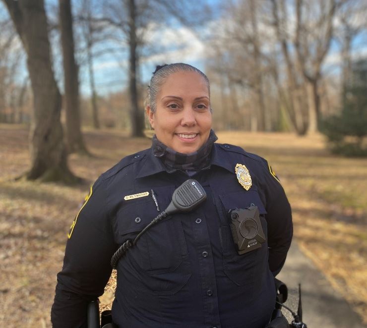 Pfc. Miltenberger pictured in her uniform in the town park