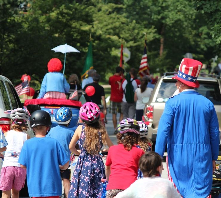 Group of residents wearing red, white and blue walking down Queens Chapel Road