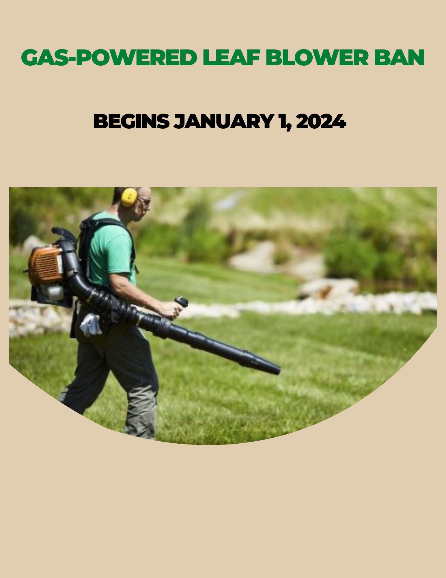 Man standing on grass with gas powered leaf blower