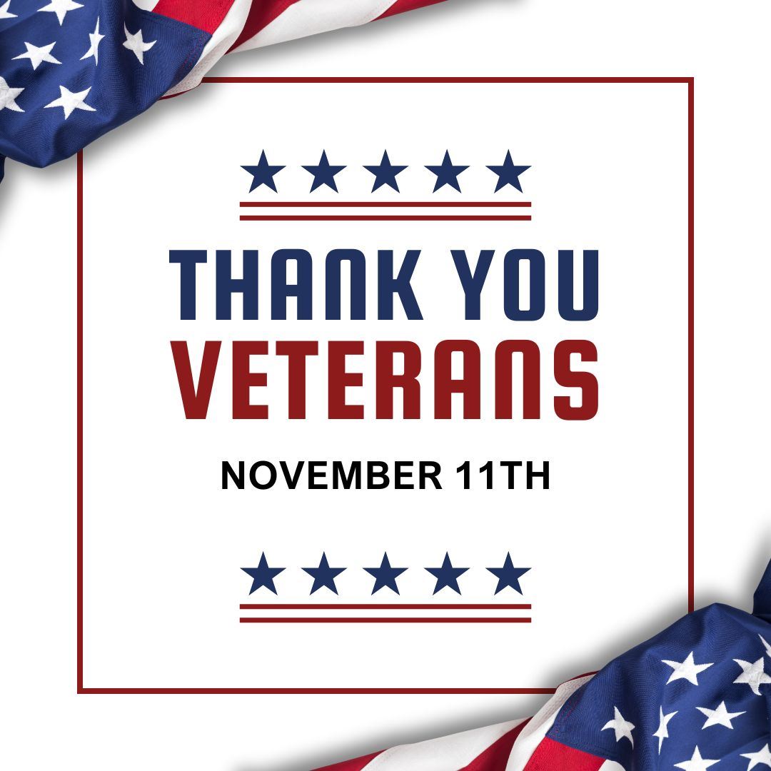 Veterans Day text with American flags on the corners