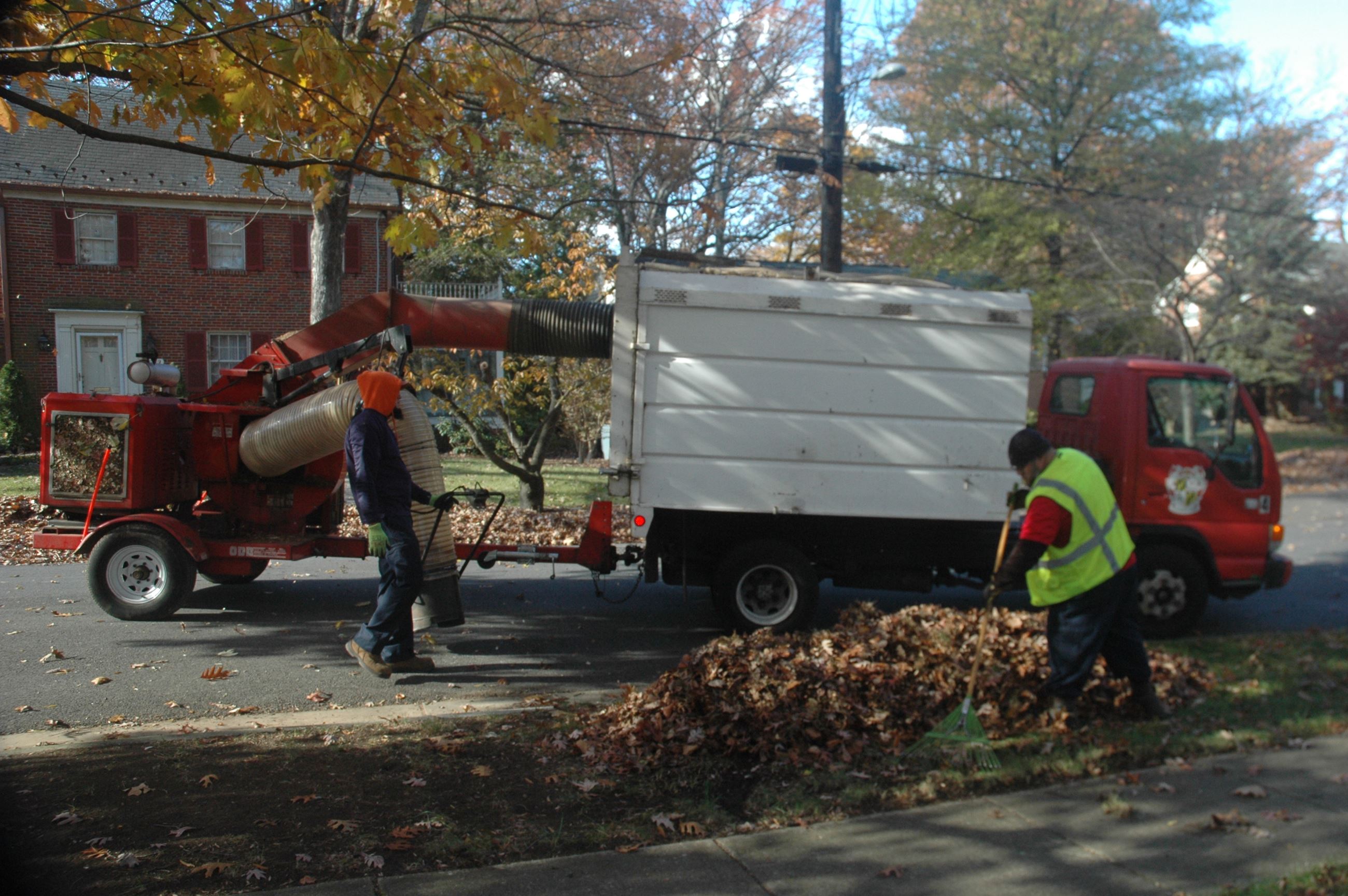 Public Works vacuuming leaves
